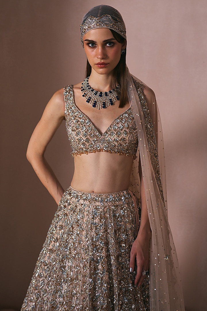 Champagne Gold Net Sequins Embroidered Bridal Lehenga Set by Angad Singh at Pernia's Pop Up Shop