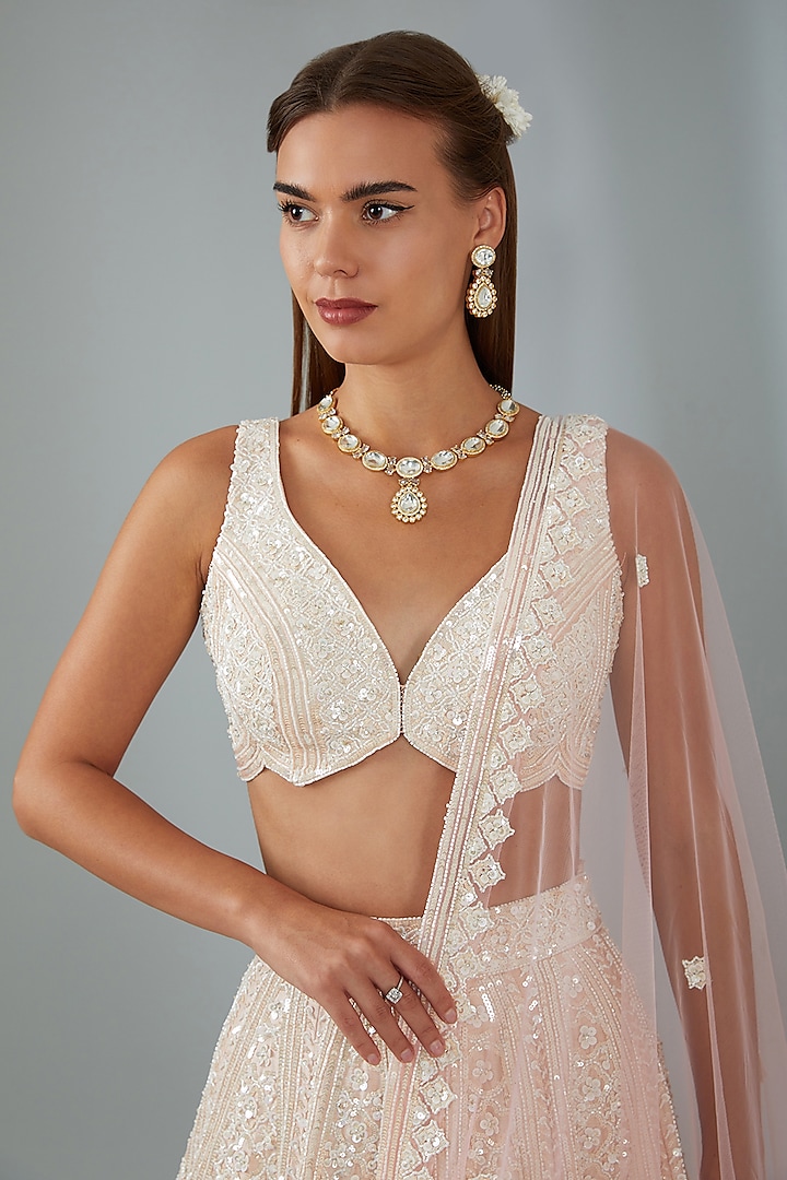 Ivory Organza Machine Embroidered Bridal Lehenga Set by Angad Singh at Pernia's Pop Up Shop