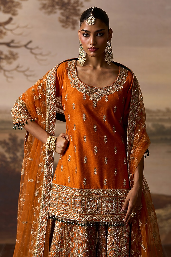 Rust Raw Silk Gold Embroidered Bridal Sharara Set by Angad Singh at Pernia's Pop Up Shop