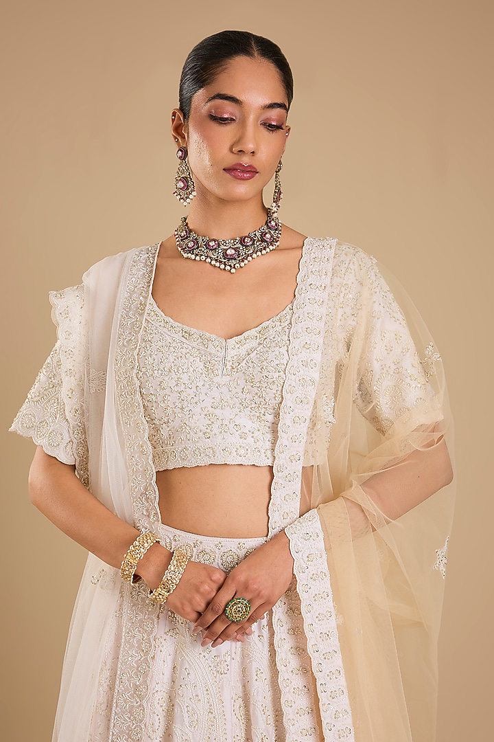Ivory Raw Silk Embroidered Bridal Lehenga Set by Angad Singh at Pernia's Pop Up Shop