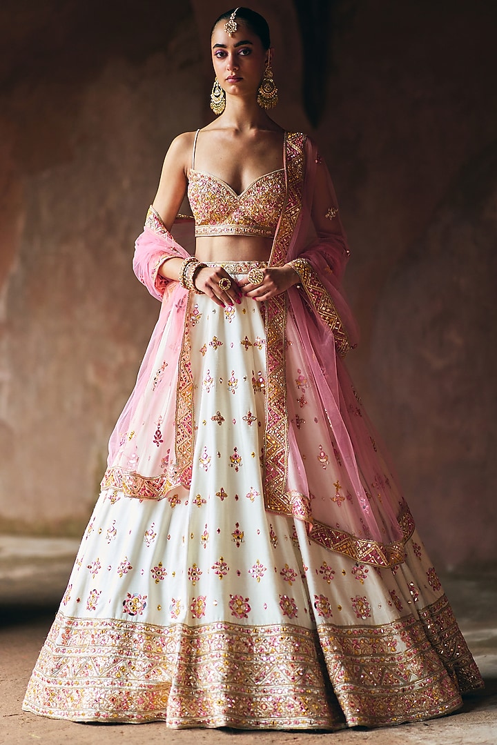 Ivory Raw Silk Mirror Embroidered Wedding Lehenga Set by Angad Singh at Pernia's Pop Up Shop