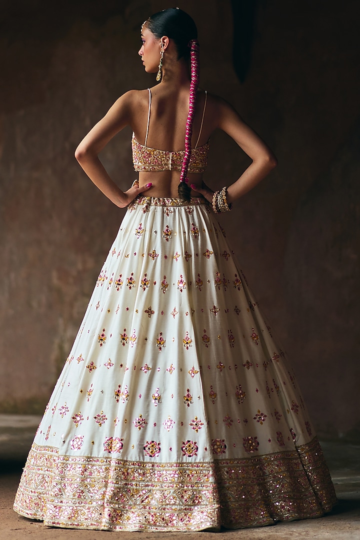 Ivory Raw Silk Mirror Embroidered Wedding Lehenga Set by Angad Singh at Pernia's Pop Up Shop