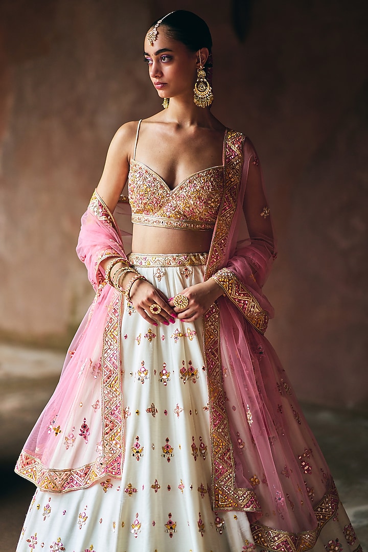 Ivory Raw Silk Mirror Embroidered Wedding Lehenga Set by Angad Singh at Pernia's Pop Up Shop