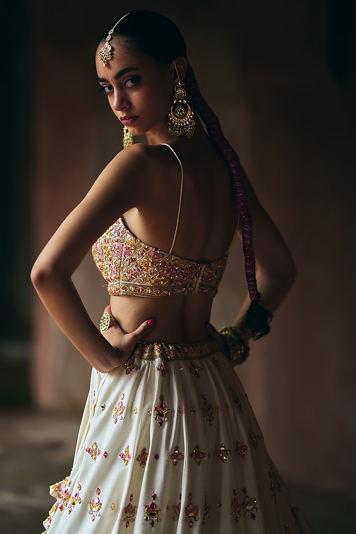 Ivory Raw Silk Mirror Embroidered Wedding Lehenga Set by Angad Singh at Pernia's Pop Up Shop