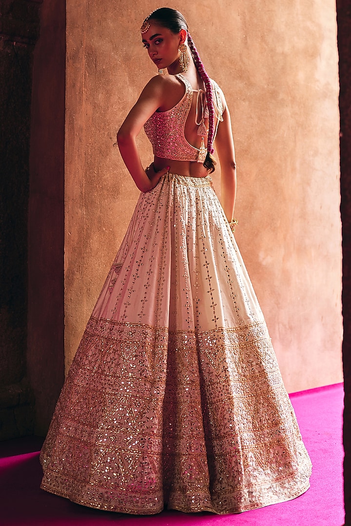 Ivory Raw Silk Mirror Embroidered Wedding Lehenga Set by Angad Singh at Pernia's Pop Up Shop