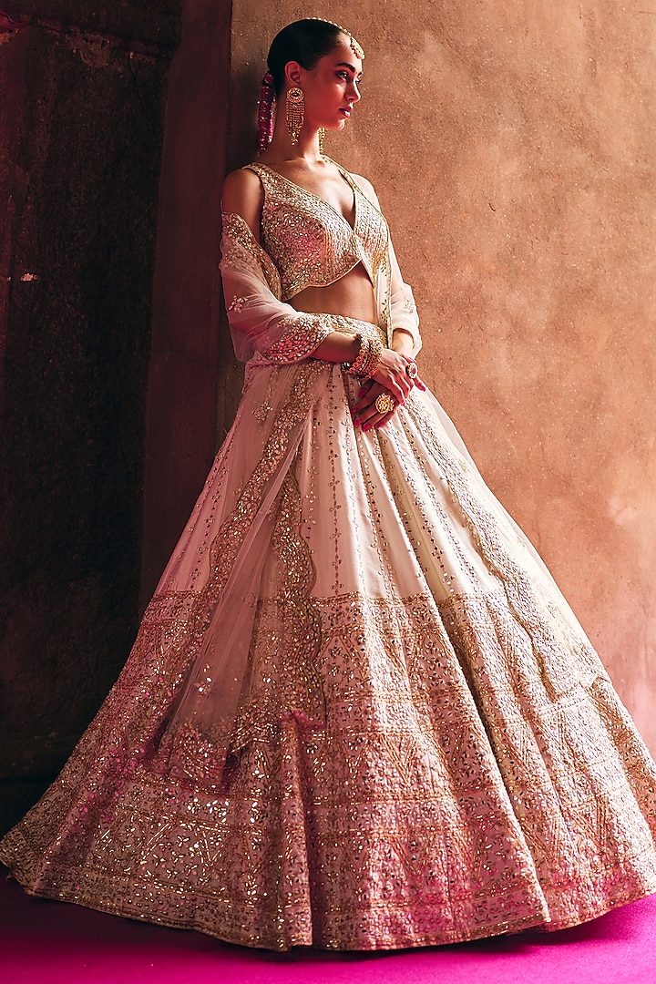 Ivory Raw Silk Mirror Embroidered Wedding Lehenga Set by Angad Singh at Pernia's Pop Up Shop