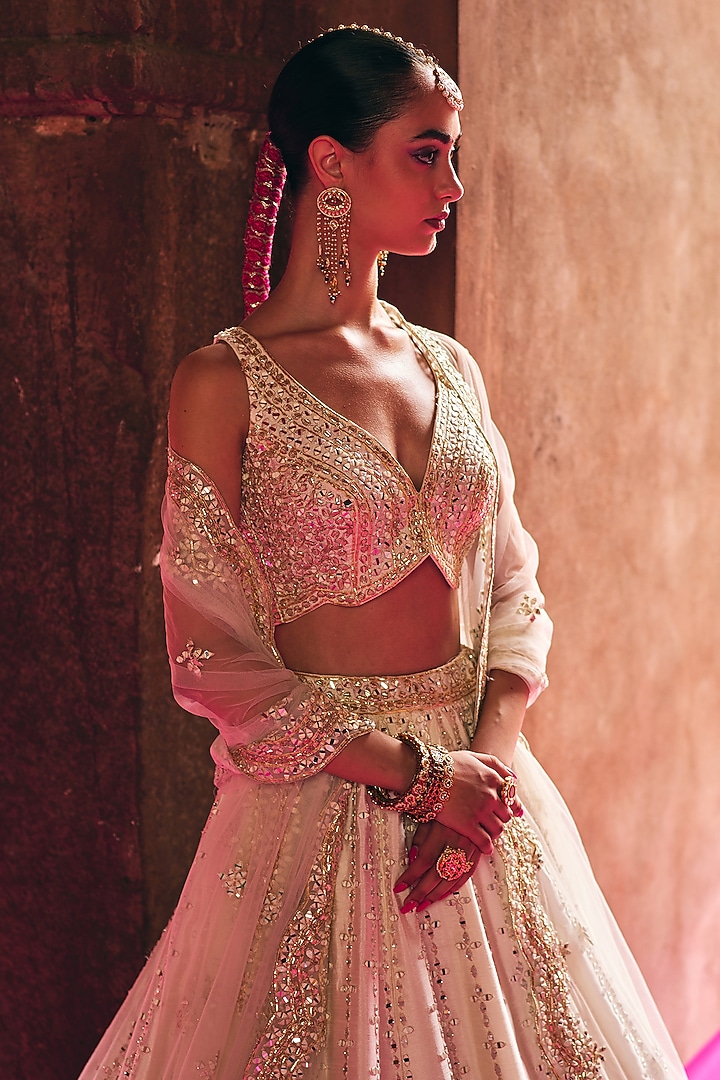 Ivory Raw Silk Mirror Embroidered Wedding Lehenga Set by Angad Singh at Pernia's Pop Up Shop