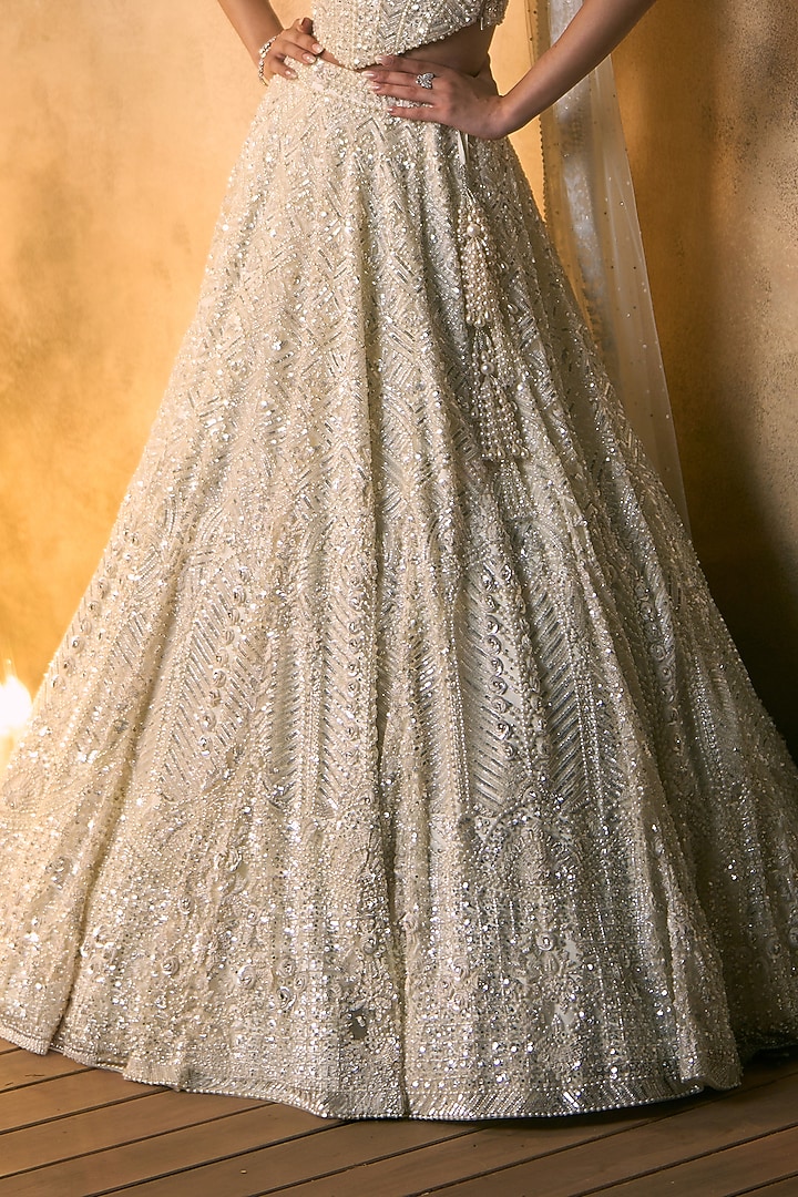 Ivory Net Embroidered Bridal Bridal Lehenga Set by Angad Singh at Pernia's Pop Up Shop