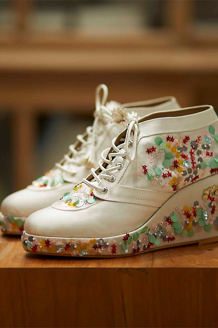 White Faux Leather Embroidered Sneaker Wedges by TIESTA