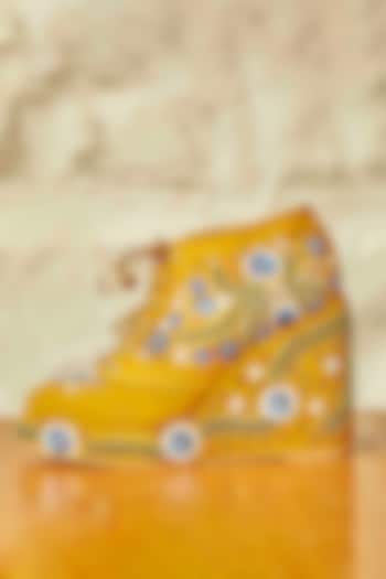 Mustard Faux Suede Leather Embroidered Sneaker Wedges by TIESTA