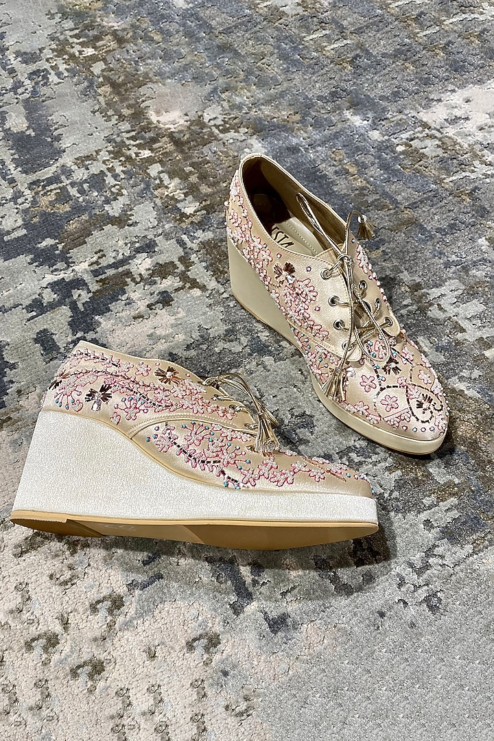 Gold Faux Leather Embroidered Sneaker Wedges by TIESTA at Pernia's Pop Up Shop