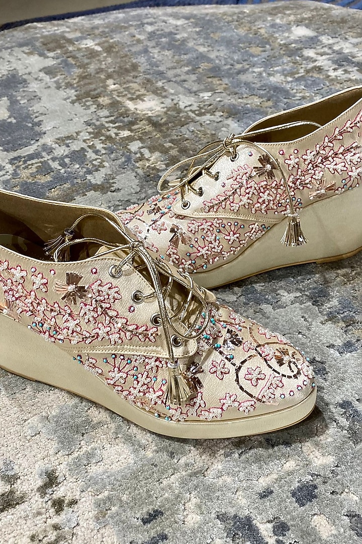 Gold Faux Leather Embroidered Sneaker Wedges by TIESTA at Pernia's Pop Up Shop