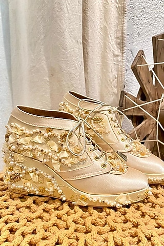 Beige Faux Leather Embroidered Sneaker Wedges by TIESTA