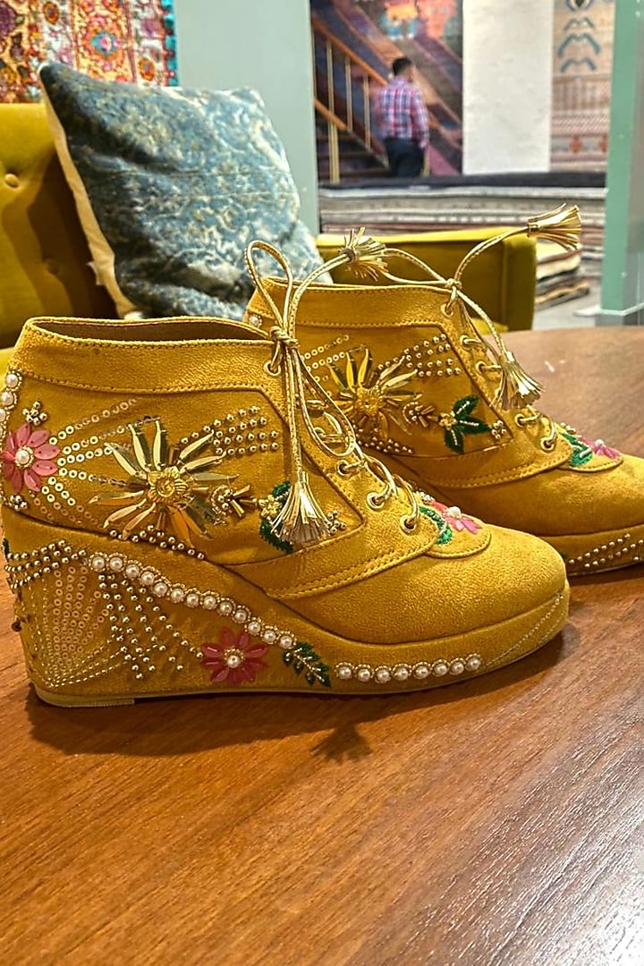 Mustard Faux Leather Embroidered Sneaker Wedges by TIESTA at Pernia's Pop Up Shop