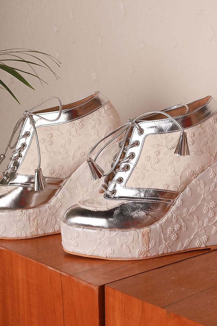 White Faux Leather Embroidered Sneaker Wedges by TIESTA at Pernia's Pop Up Shop