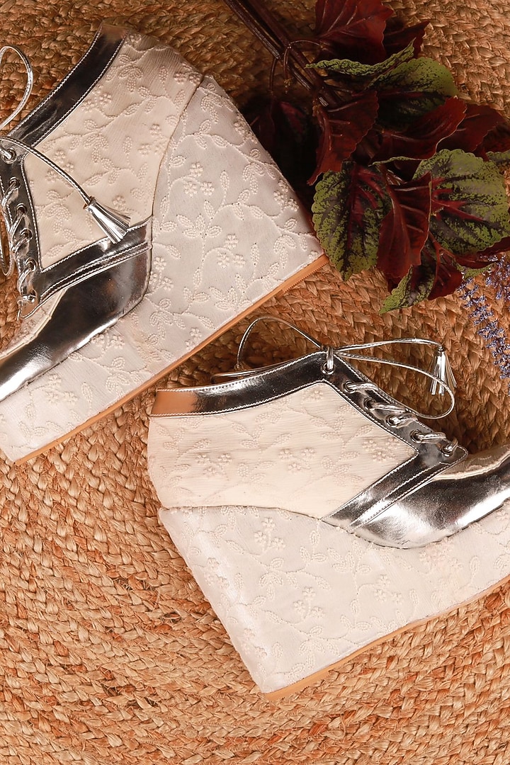 White Faux Leather Embroidered Sneaker Wedges by TIESTA at Pernia's Pop Up Shop