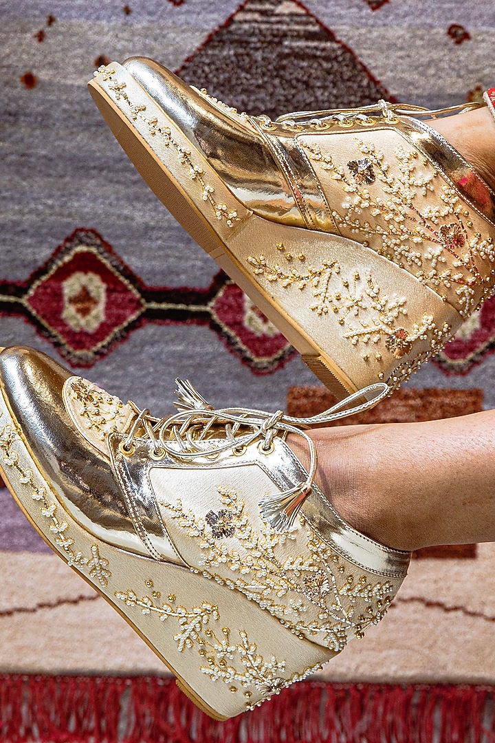 Gold Faux Leather Hand Embroidered Sneaker Wedges by TIESTA at Pernia's Pop Up Shop