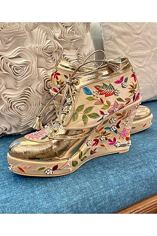 Gold Faux Leather Hand Embroidered Sneaker Wedges by TIESTA