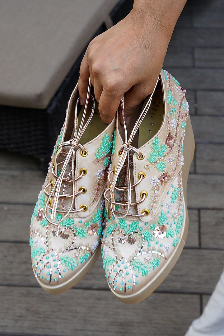 Gold Faux Leather Hand Embroidered Sneaker Wedges by TIESTA