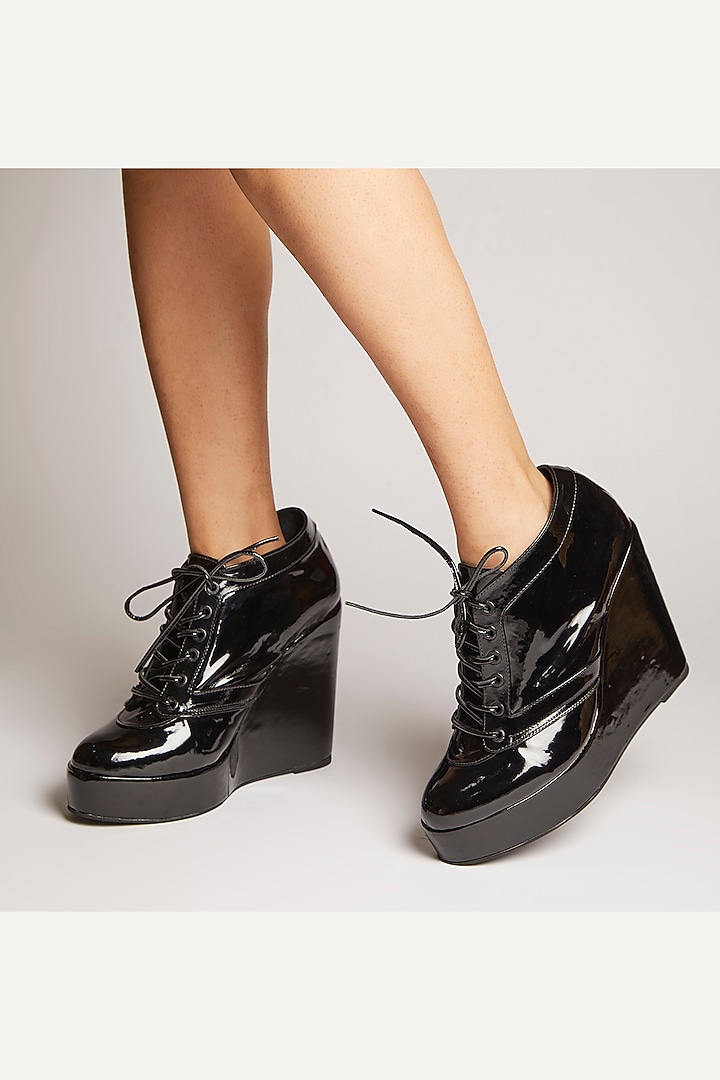 Black Faux Leather Sneaker Wedges by TIESTA at Pernia's Pop Up Shop