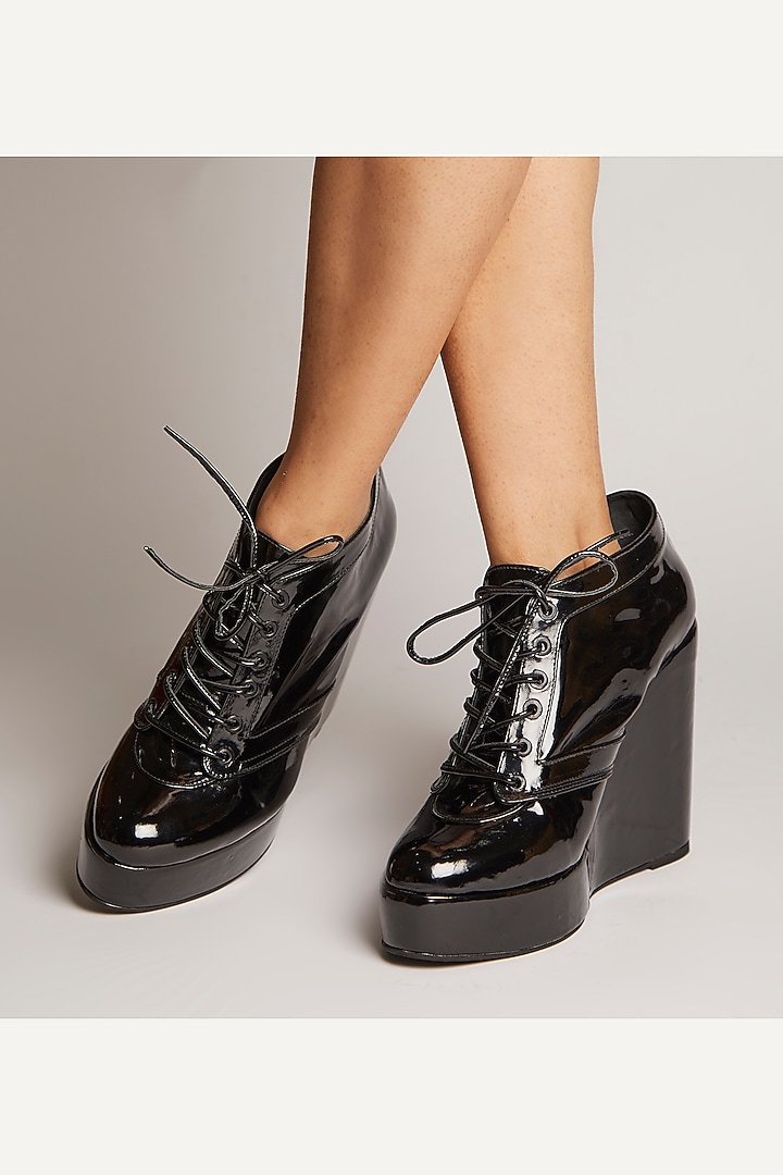 Black Faux Leather Sneaker Wedges by TIESTA at Pernia's Pop Up Shop