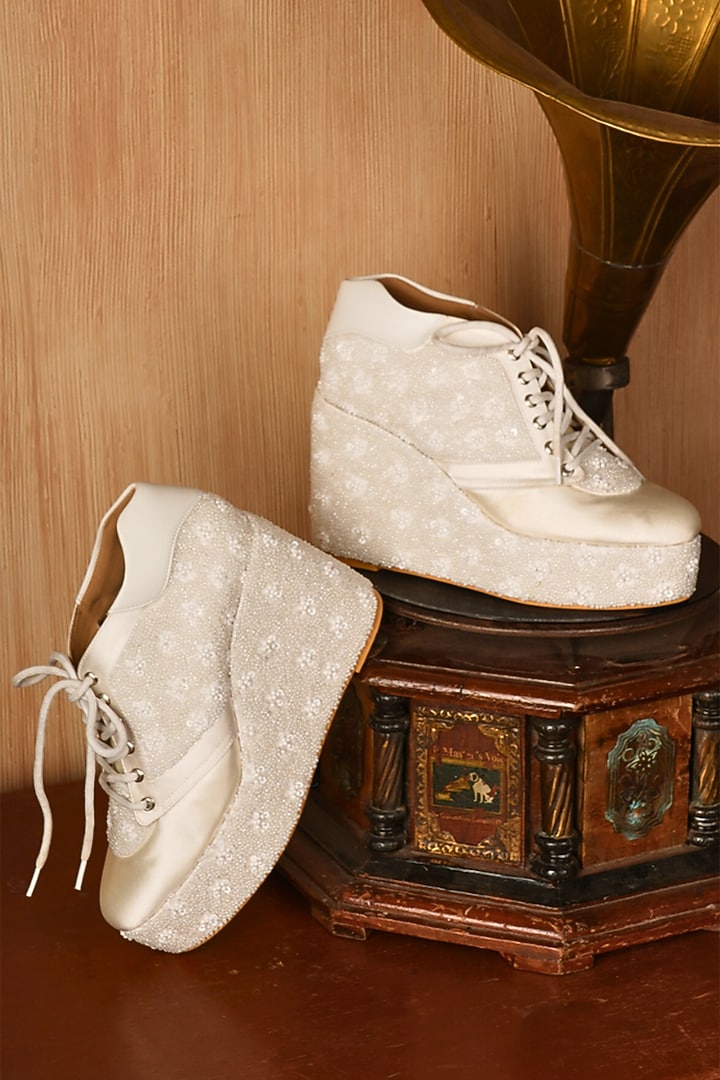 White Satin Floral Bead Work Wedge Sneakers by TIESTA at Pernia's Pop Up Shop