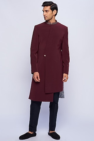 Burgundy Asymmetric Sherwani by TISASTUDIO