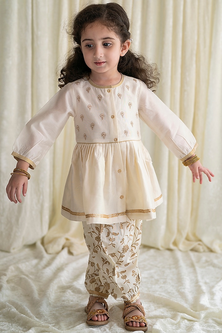 Cream Embroidered Angrakha Kurta Set With Hair Bow Clip For Girls by Tiber Taber at Pernia's Pop Up Shop