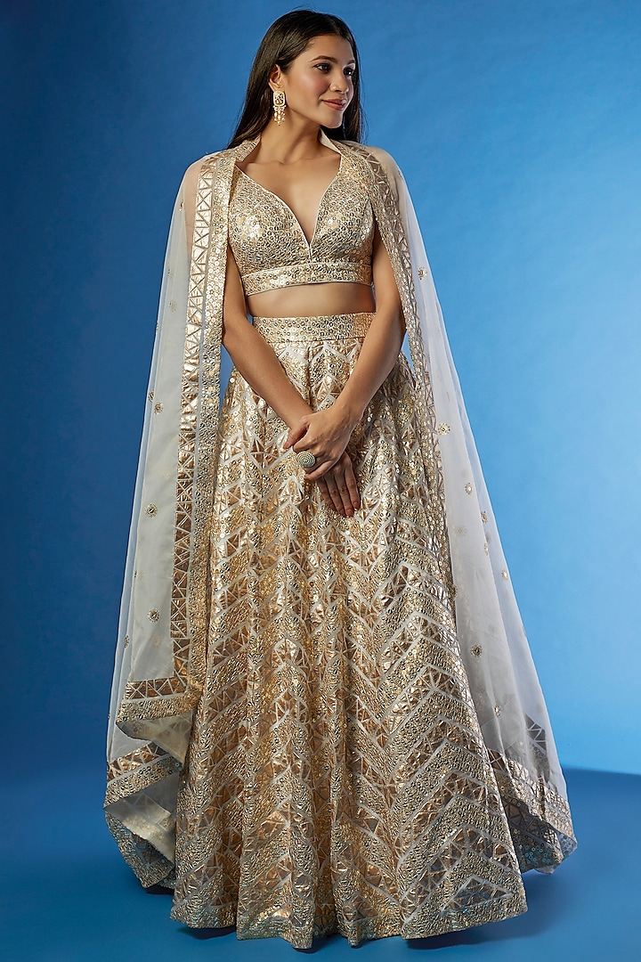 Gold Net Embroidered Lehenga Set by Angad Singh
