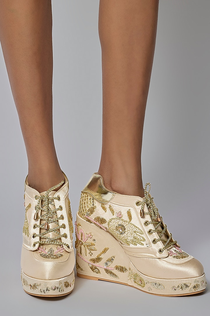 Gold Satin Embroidered Sneaker Wedges by TIESTA at Pernia's Pop Up Shop