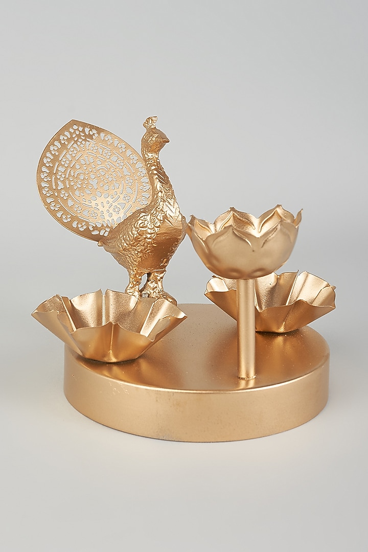 Gold Iron Lotus & Peacock Diya With Stand by The Khabiyas Trunk by KJ at Pernia's Pop Up Shop
