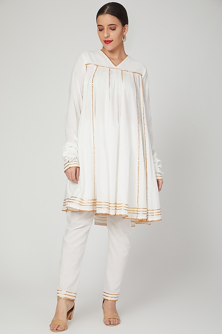 White Gota Embroidered Narrow Pants by THE LABEL UNTOLD