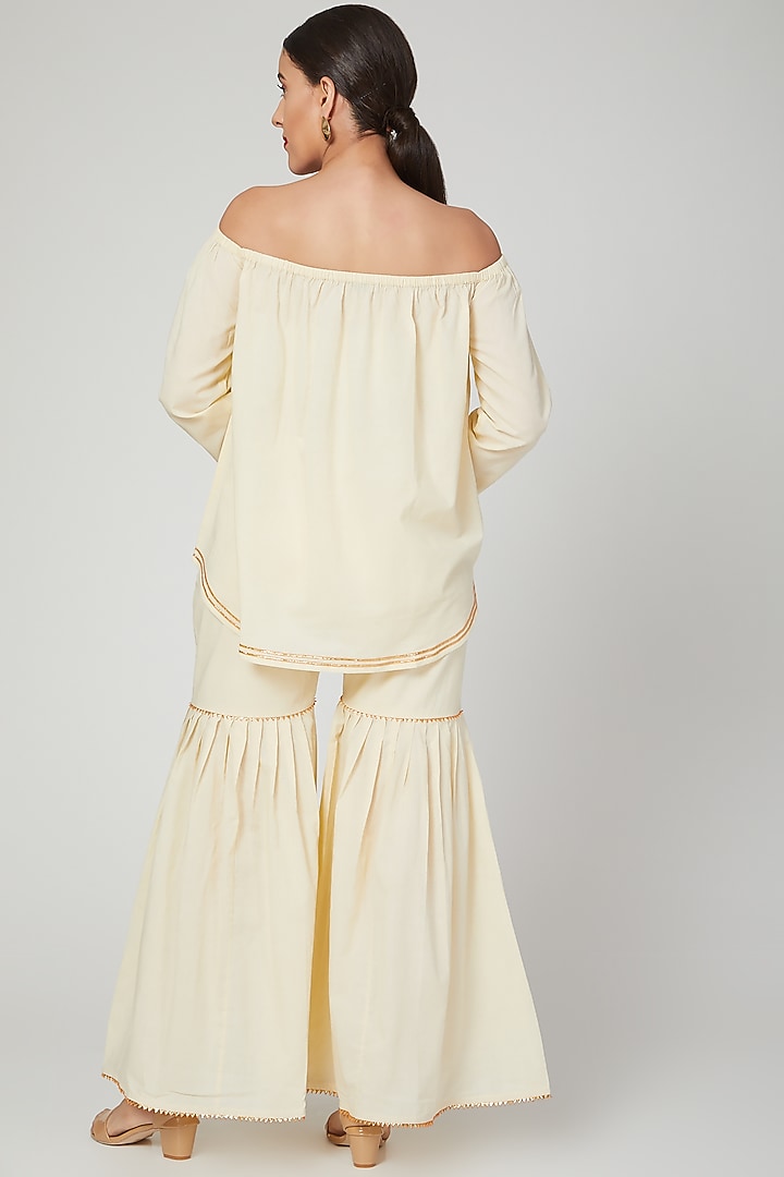 Beige Embroidered Off Shoulder Top by THE LABEL UNTOLD at Pernia's Pop Up Shop