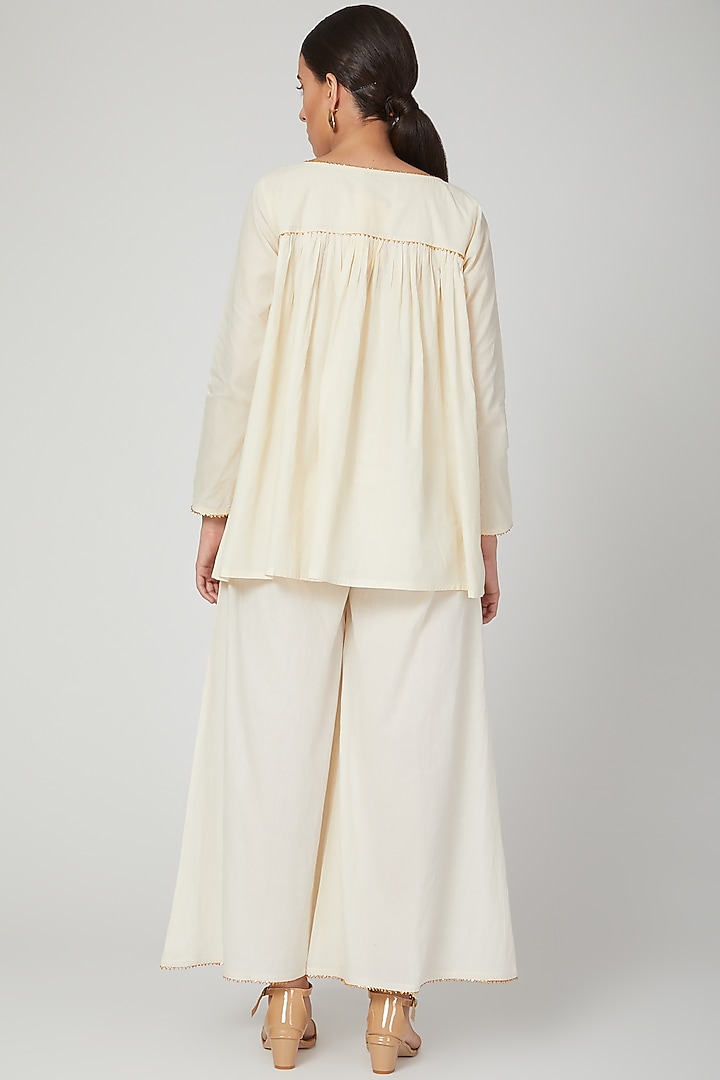 Beige Embroidered Palazzo Pants by THE LABEL UNTOLD at Pernia's Pop Up Shop