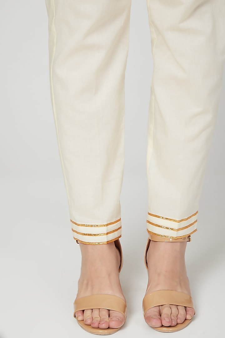 Beige Embroidered Narrow Pants by THE LABEL UNTOLD at Pernia's Pop Up Shop