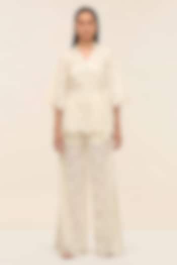 Ivory Schiffli Hand Embroidered Flared Pants by TANGERINE at Pernia's Pop Up Shop