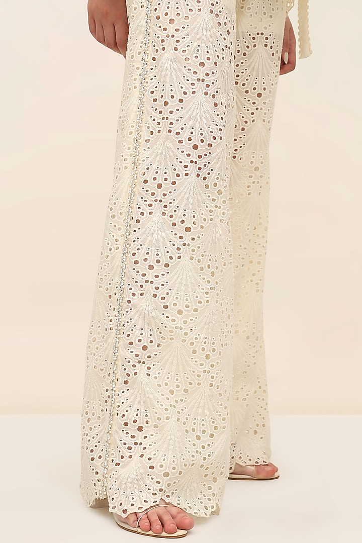 Ivory Schiffli Hand Embroidered Flared Pants by TANGERINE at Pernia's Pop Up Shop