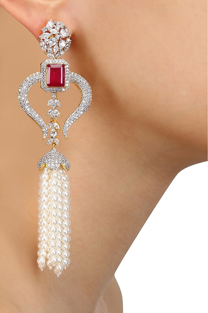 Tanzilla presents Rhodium and gold dual finish white sapphire and ruby tassle earrings available only at Pernia's Pop Up Shop.