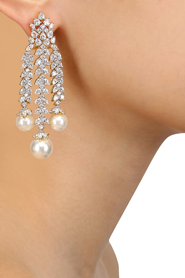 Tanzilla presents Rhodium and gold dual finish marquise sapphire and pearl earrings available only at Pernia's Pop Up Shop.