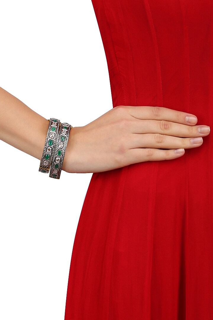 Tanzilla presents Set of Rhodium finish emerald and white sapphire bangles available only at Pernia's Pop Up.