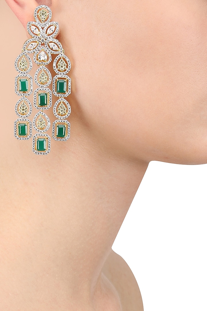 Tanzila Rab presents White and gold dual finish emerald and sapphires earrings available only at Pernia's Pop Up Shop.