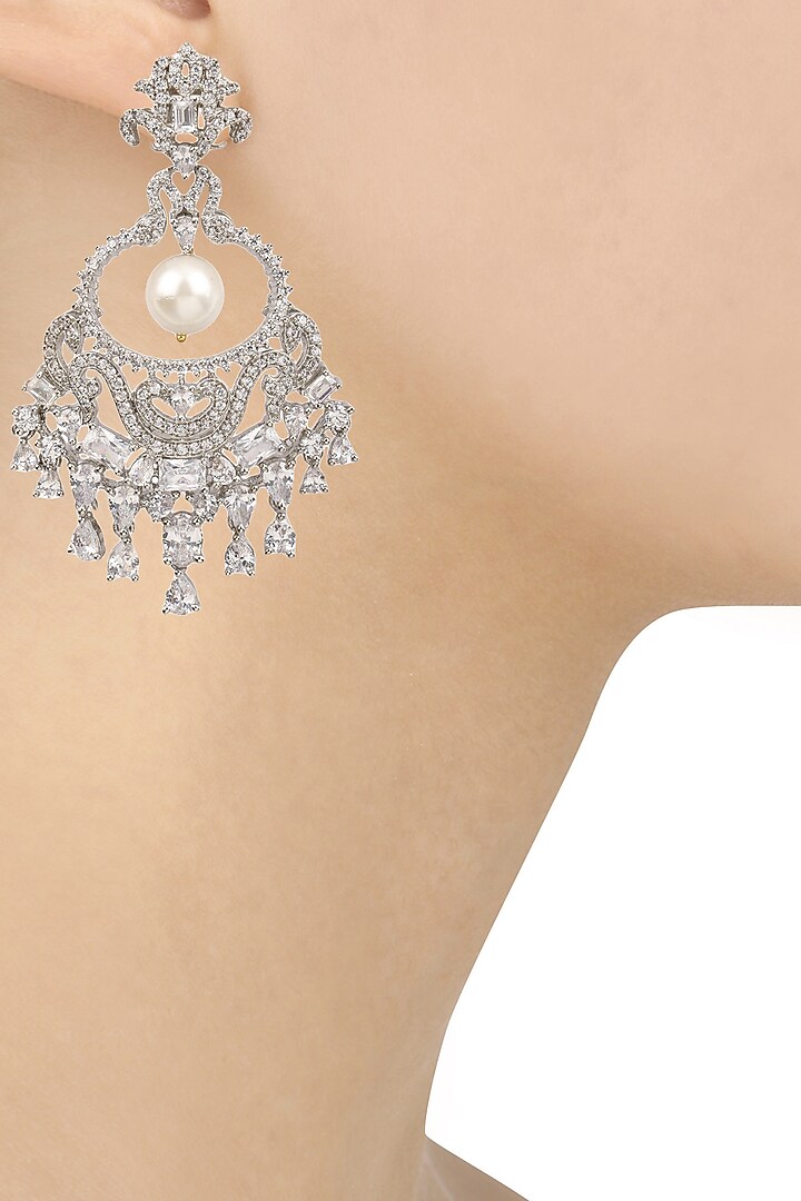 Tanzila Rab presents Rhodium finish sapphire and pearl cocktail earrings available only at Pernia's Pop Up Shop.
