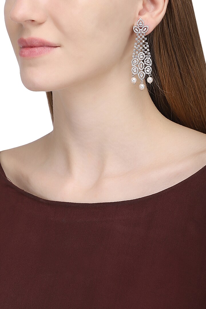 Silver plated white sapphire and shell pearl dangler earrings by Tanzila Rab at Pernia's Pop Up Shop