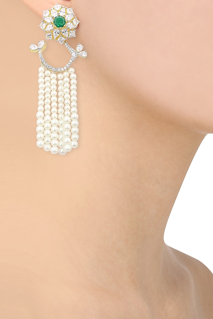 Dual rhodium and 22k gold finish cocktail earrings available only at Pernia's Pop Up Shop.