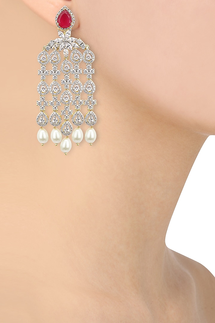 Dual rhodium and 22k gold finish dangler earrings available only at Pernia's Pop Up Shop.