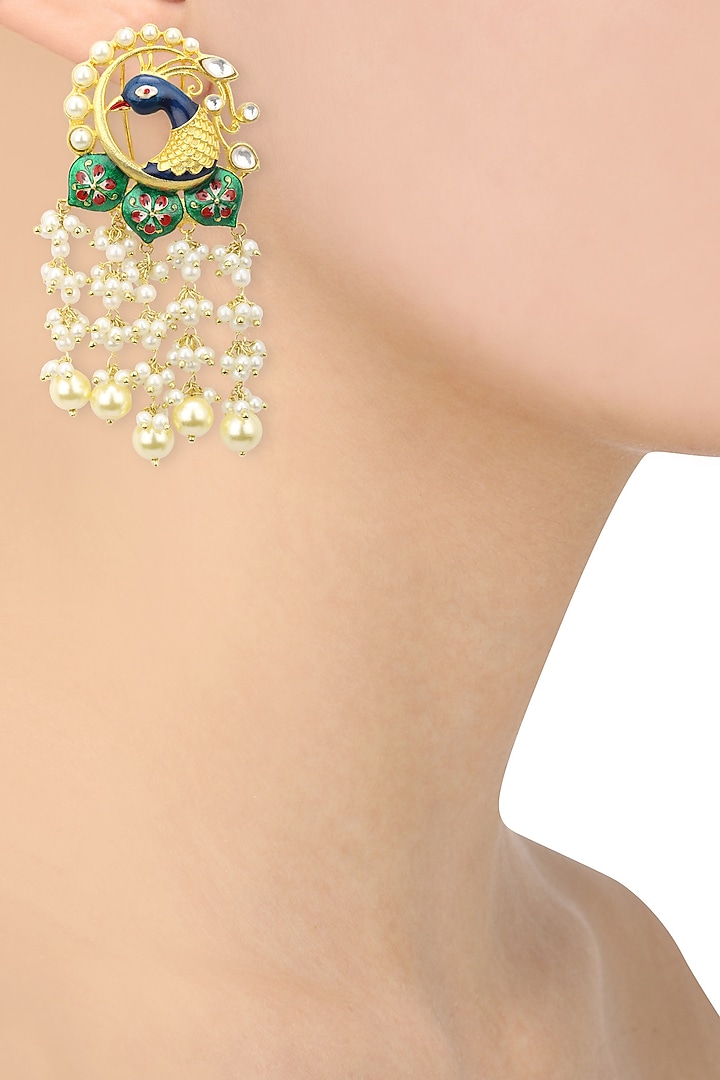 22k gold finish peacock motif earrings available only at Pernia's Pop Up Shop.