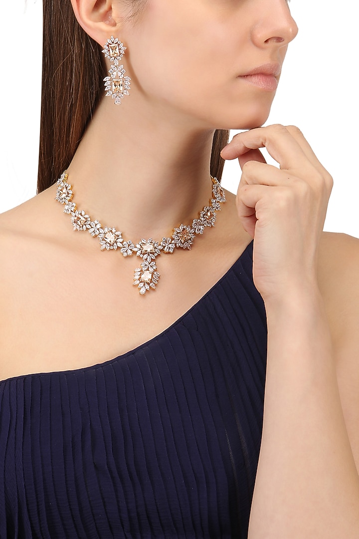 Rhodium and gold finish white sapphire and topaz necklace available only at Pernia's Pop Up Shop.