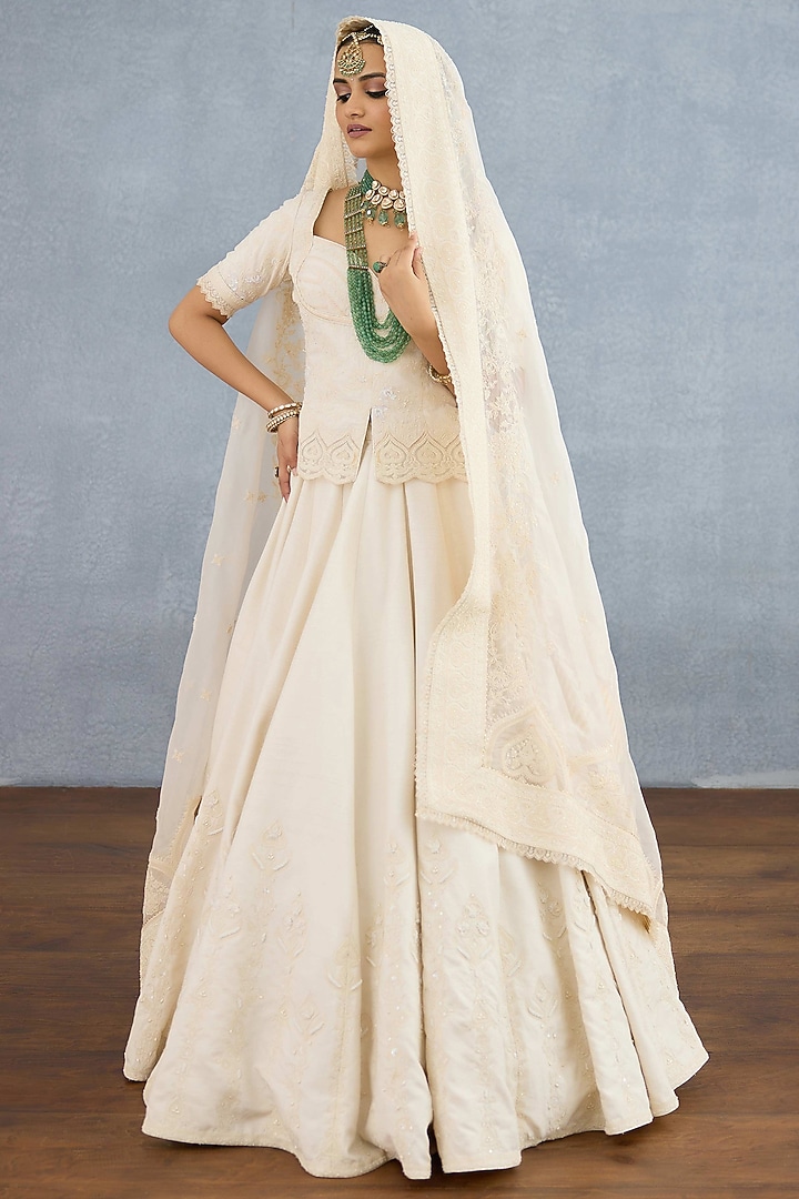 Ivory Jeni Silk & Organza Embroidered Bridal Lehenga Set by TORANI at Pernia's Pop Up Shop