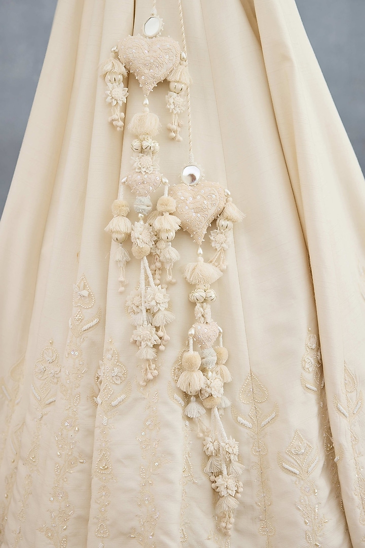 Ivory Jeni Silk & Organza Embroidered Bridal Lehenga Set by TORANI at Pernia's Pop Up Shop