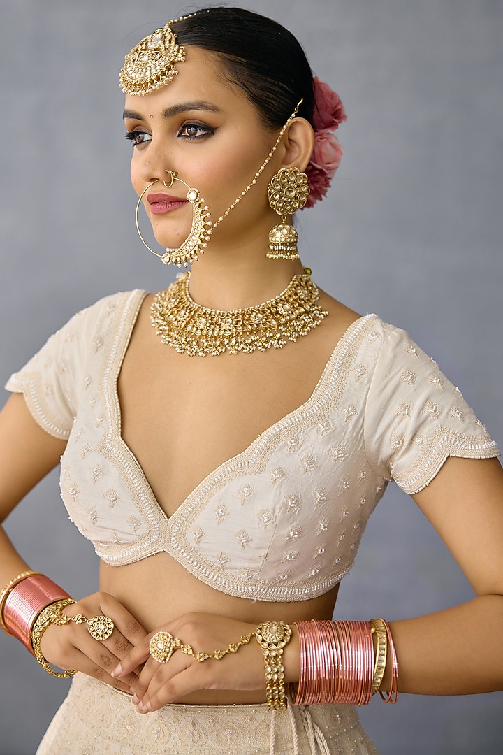 Ivory Jeni Silk & Organza Embroidered Bridal Lehenga Set by TORANI at Pernia's Pop Up Shop